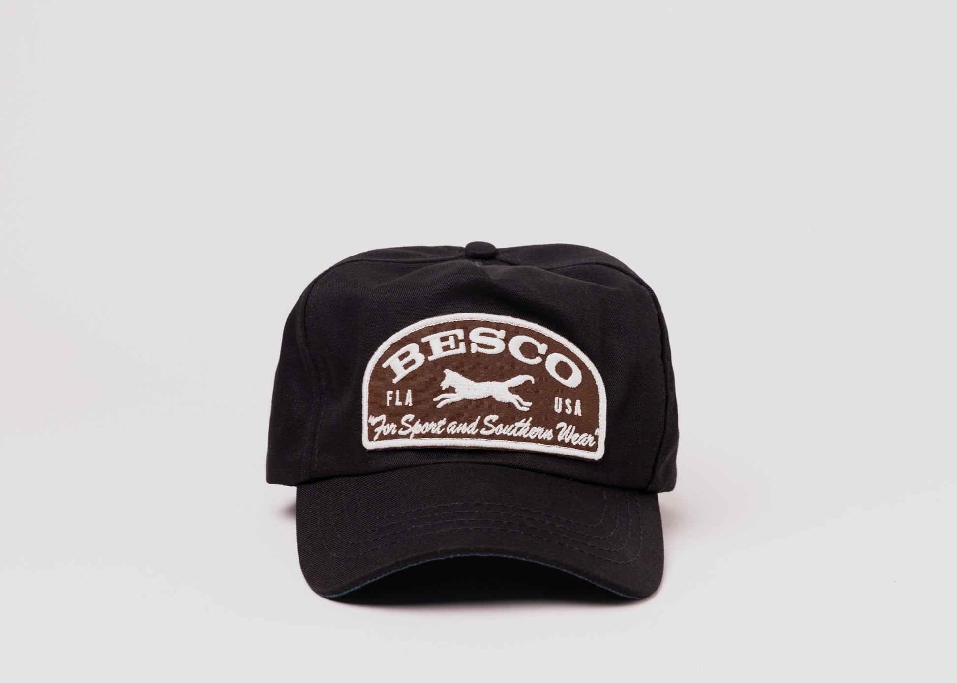 Black Besco hat with brown and white embroidered fox patch reading ‘For Sport and Southern Wear', front view on white background.
